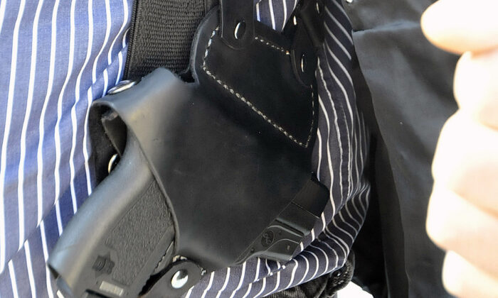 A small handgun is seen under a vest in High Point, N.C., on Jan. 2, 2012. (Sonny Hedgecock/The Enterprise via AP, File)