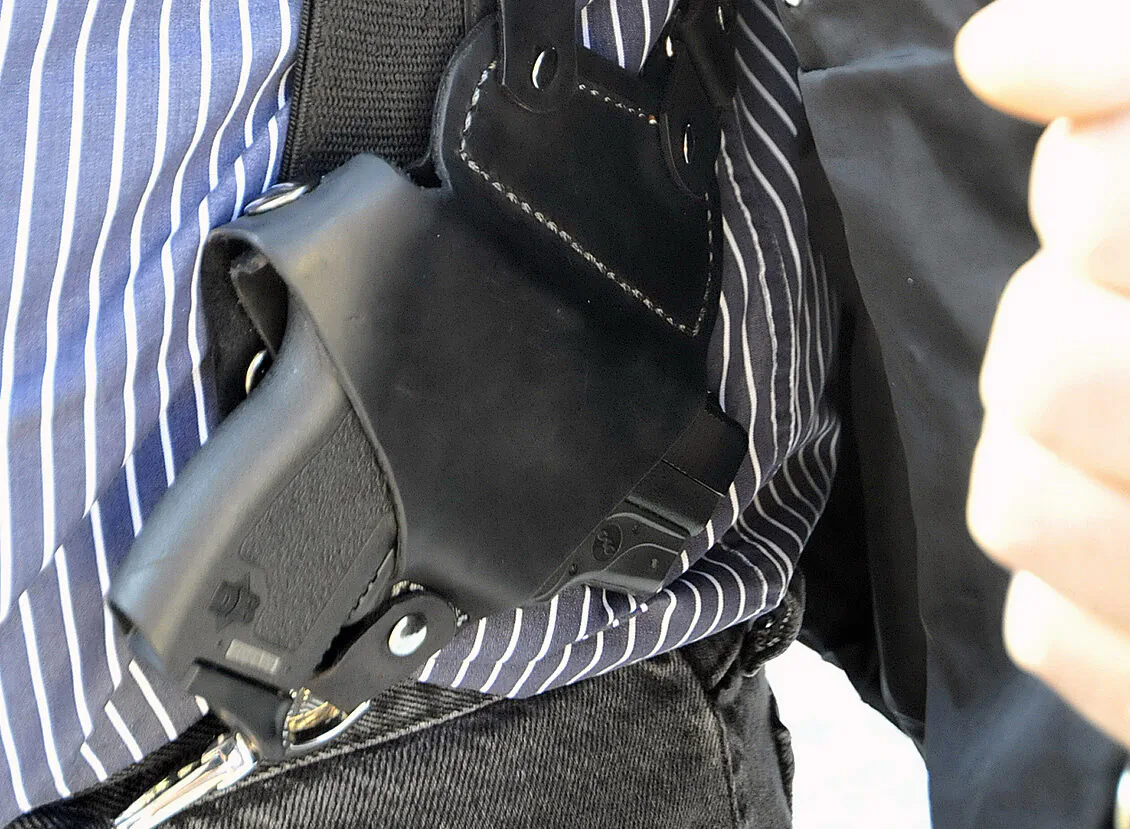 A small handgun is seen under a vest in High Point, N.C., on Jan. 2, 2012. (Sonny Hedgecock/The Enterprise via AP, File)