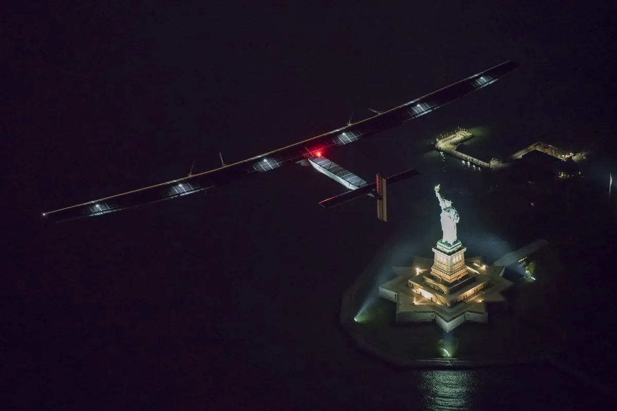 Solar Impulse 2, piloted by Swiss adventurer Andre Borschberg, flies over the Statue of Libery in New York Saturday, June 11, 2016 shortly before landing at John F. Kennedy International Airport. (Jean Revillard/ SI2 via AP) 