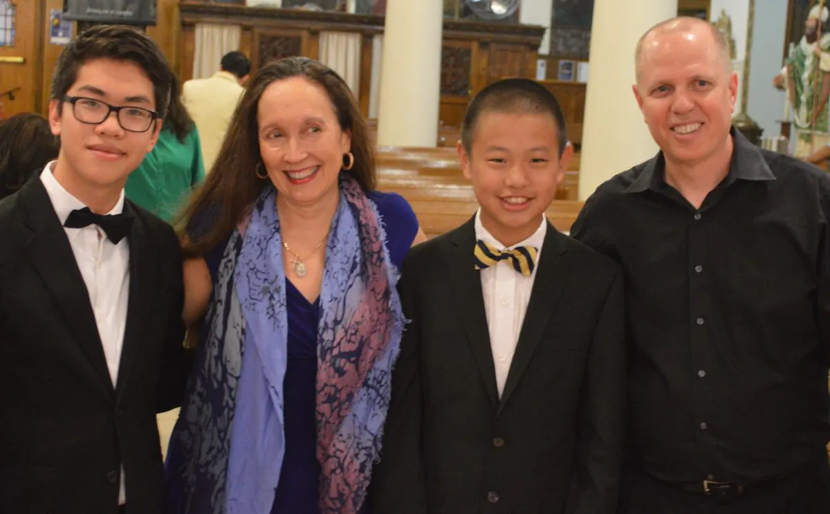 (L–R) Trenton Chang, pianist; Artistic Director/Founder Julie Jordan; Jiayang Jin, pianist; and Conductor Paul Hostetter celebrate their Rachmaninoff and Mozart concerto debuts at St. Gregory the Great Church on June 6.  (Tom Chang)