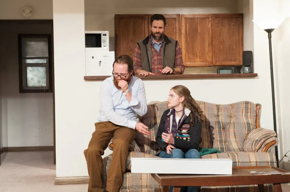 Mentally ill Ellis (William Apps) is constantly monitored by nurse Barrett (Connor Barrett, in the background), especially when he has visitors, such as young Catherine (Katherine Reis), in “The Purple Lights of Joppa, Illinois.” (Ahron Foster)
