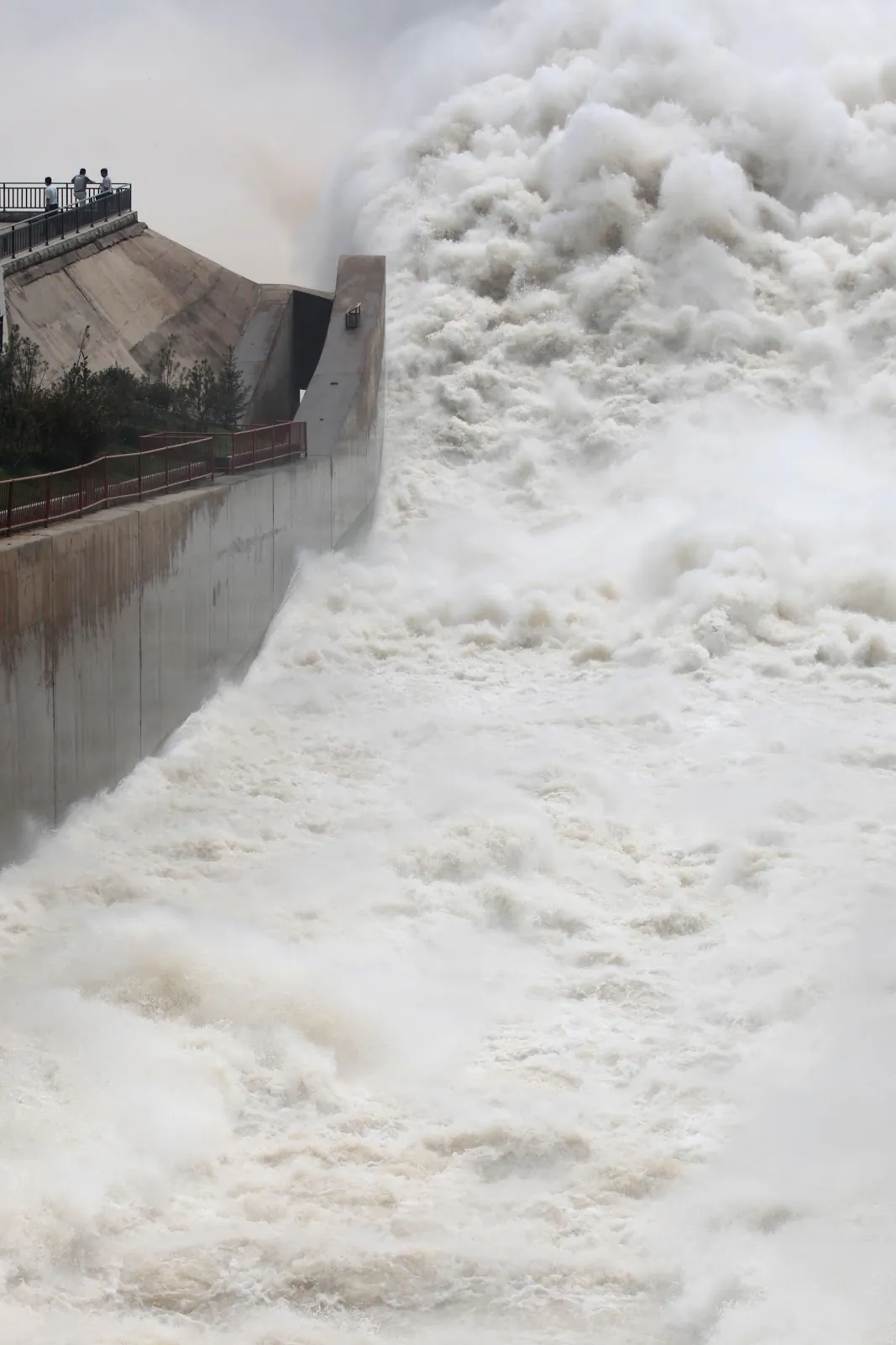 People watch as floodwaters are released from the Yellow River, China, on July 23, 2013. (STR/AFP/Getty Images)