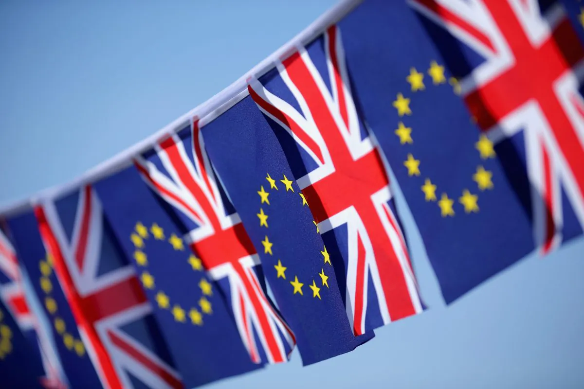 The European Union and the United Kingdom flags sit together on bunting in Knutsford, U.K., on March 17, 2016. (Christopher Furlong/Getty Images)