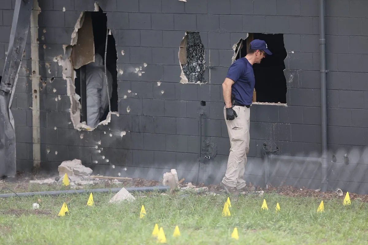 FBI agents investigate the damaged rear wall of the nightclub Pulse, where Omar Mateen allegedly killed at least 50 people in Orlando, Fla., on June 12, 2016. (Joe Raedle/Getty Images)