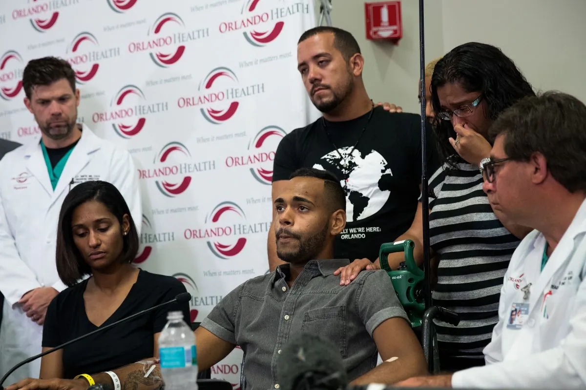 ORLANDO, FL - JUNE 14: Surrounded by medical personnel and his siblings, Angel Colon, who was injured in the Pulse Nightclub shooting, speaks to the media during a press conference at Orlando Regional Medical Center, June 14, 2016 in Orlando, Florida. The shooting at Pulse Nightclub, which killed 49 people and injured 53, is the worst mass-shooting event in American history. (Photo by Drew Angerer/Getty Images)