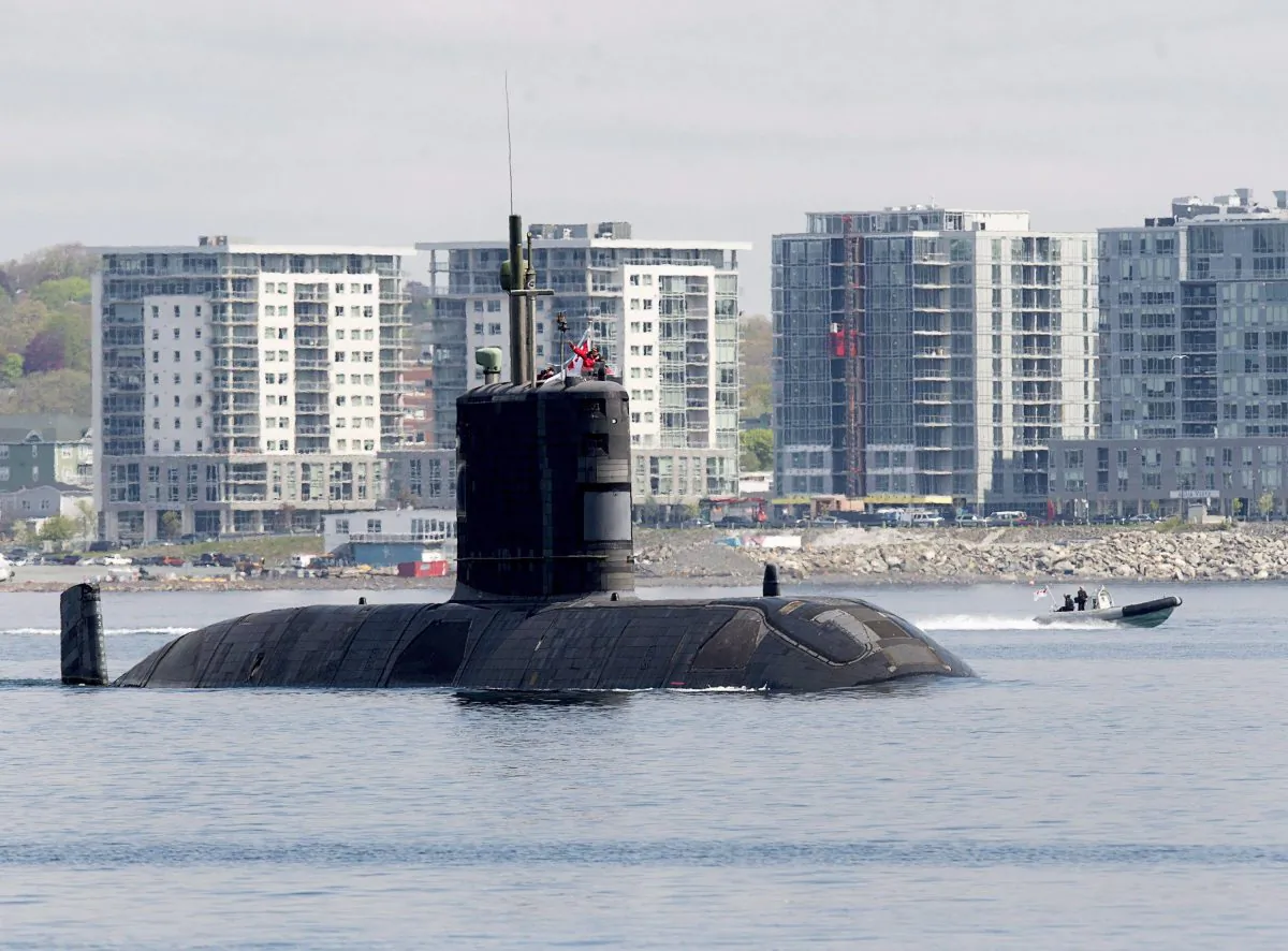 The submarine HMCS Windsor heads out of the harbour in Halifax on May 26, 2016. (The Canadian Press/Andrew Vaughan)