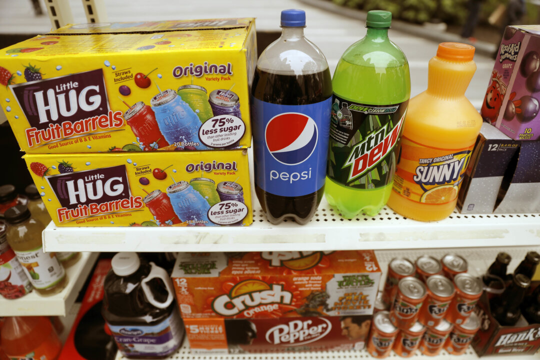 Study of plasticizers in popular drinks found that regardless of the packaging, added sugar was the kicker. (AP Photo/Matt Rourke)