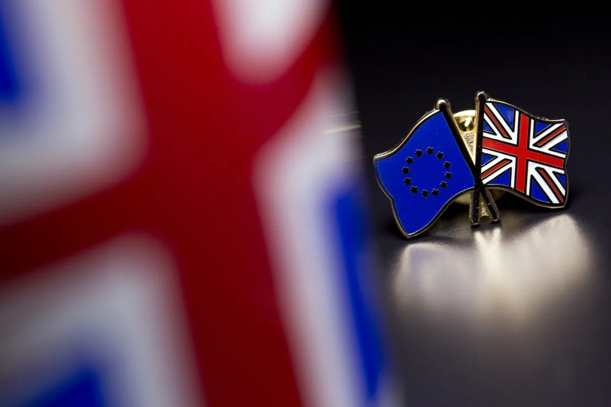 The European Union and the United Kingdom flags are pictured on a pin badge in London, U.K., on March 17, 2016. (Dan Kitwood/Getty Images)