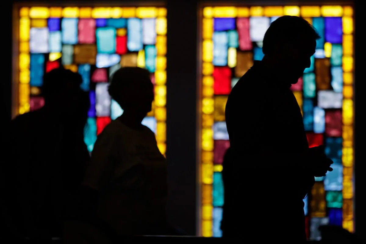 People attend a prayer service for the Pulse nightclub shooting victims at Delaney Street Baptist Church in Orlando, Fla., on June 15, 2016. The shooting, which killed 49 people and injured 53, is the worst mass shooting in American history. (Drew Angerer/Getty Images)