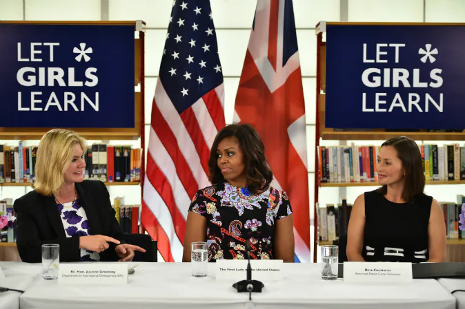 US First Lady Michelle Obama (C) sits between The UK Department of International Development's Justine Greening and (L) returned Peace Corps Volunteer Bina Contreras (R) during a 'Let Girls Learn' meeting as part of the 'Let Girls Learn Initiative' at the Mulberry School for Girls on June 16, 2015 in London, England. (Jeff J Mitchell/Getty Images)