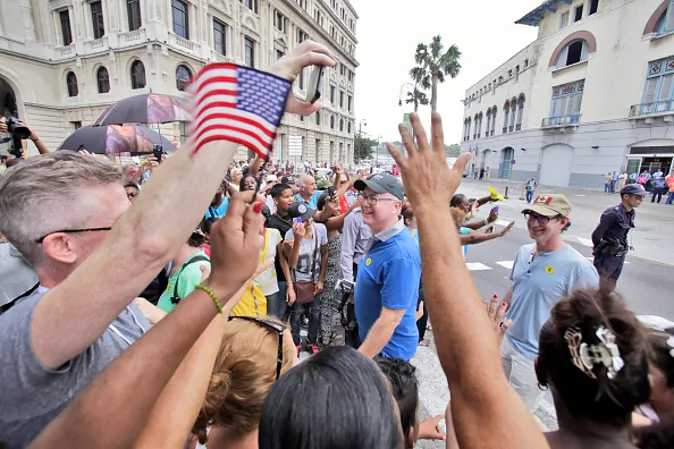 HAVANA, CUBA - MAY 2: American passengers are being welcomed by Cubans upon arriving in Cuba aboard the cruise ship Adonia, the first US cruise ship in nearly forty years to arrive in Cuba, on May 2, 2016, in Havana, Cuba. The Adonia, belonging to the Carnival group, carried some 700 passengers on its sail from Miami to Havana, officially re-establishing the US cruise business in Cuba.(Photo by Sven Creutzmann/Mambo photo/Getty Images)