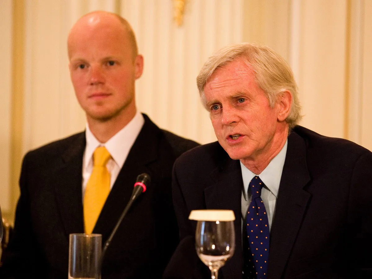 OLYMPIC SPIRIT: David Kilgour speaks at a press conference prior to the opening of the Human Rights Torch Relay in Athens on August 9, as 2006 Winter Olympics Bronze medallist Martins Rubenis, official Ambassador of the Relay, looks on. (Jan Jekielek/The Epoch Times)