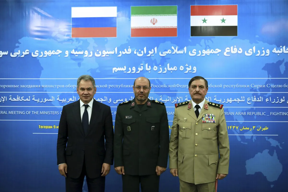 Iran's Defense Minister Gen. Hossein Dehghan (C), and his counterparts from Russia Sergei Shoigu (L), and Syria Gen. Fahd Jassem al-Freij attend a trilateral meeting in Tehran, Iran, on June 9, 2016. (Iranian Defense Ministry via AP)