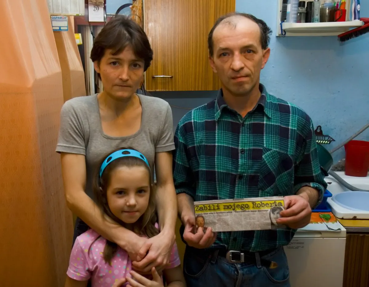 TELL THE TRUTH: A distraught Kosowski family poses with an article from a Polish tabloid they say contains misleading information. (Jan Jekielek/The Epoch Times)