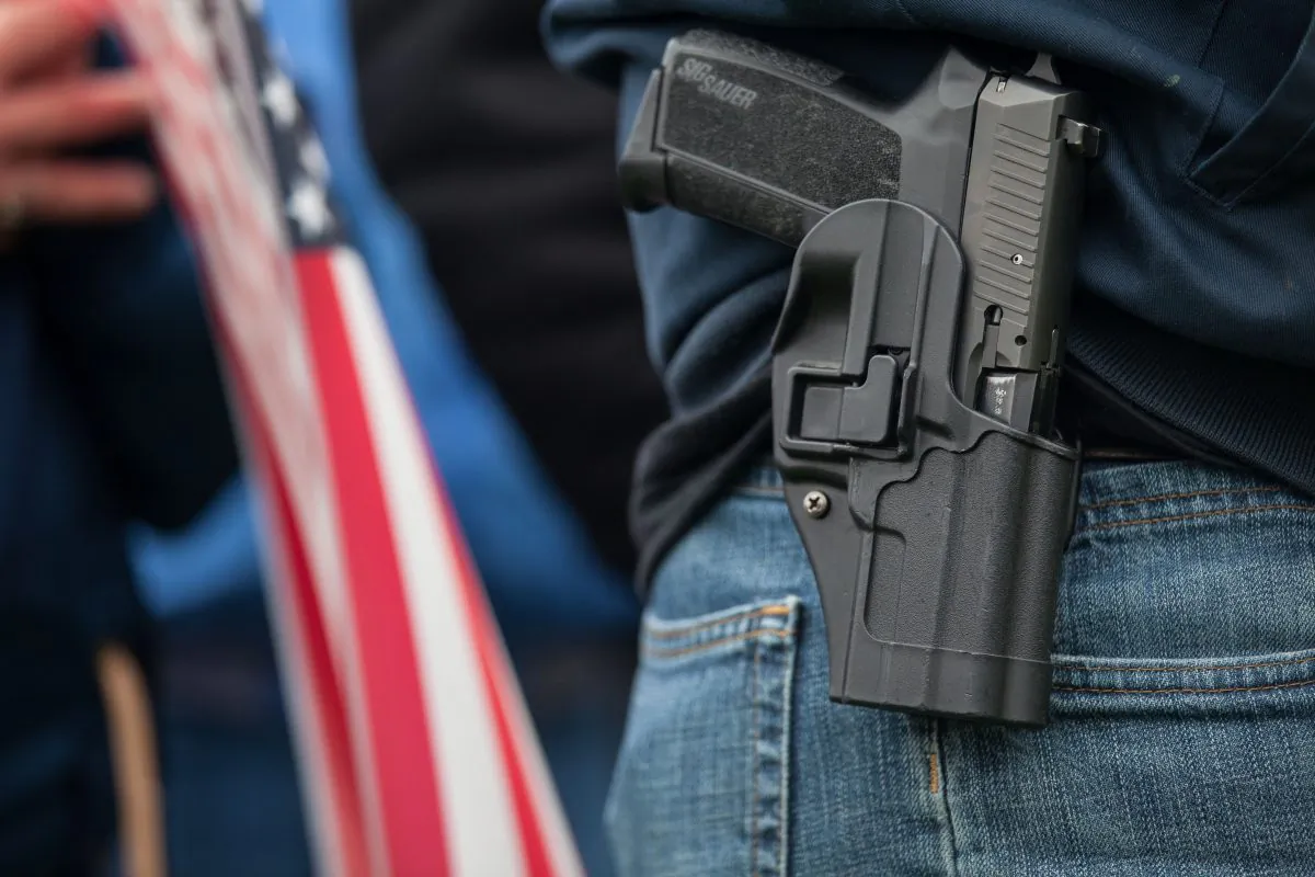 A handgun in a holster in a file photo. (David Ryder/Getty Images)