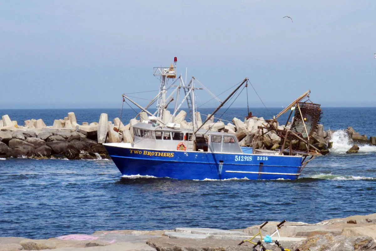 In this May 4, 2012 file photo, a commercial scallop fishing boat enters the Manasquan Inlet in Point Pleasant, N.J. (Wayne Parry/AP Photo)