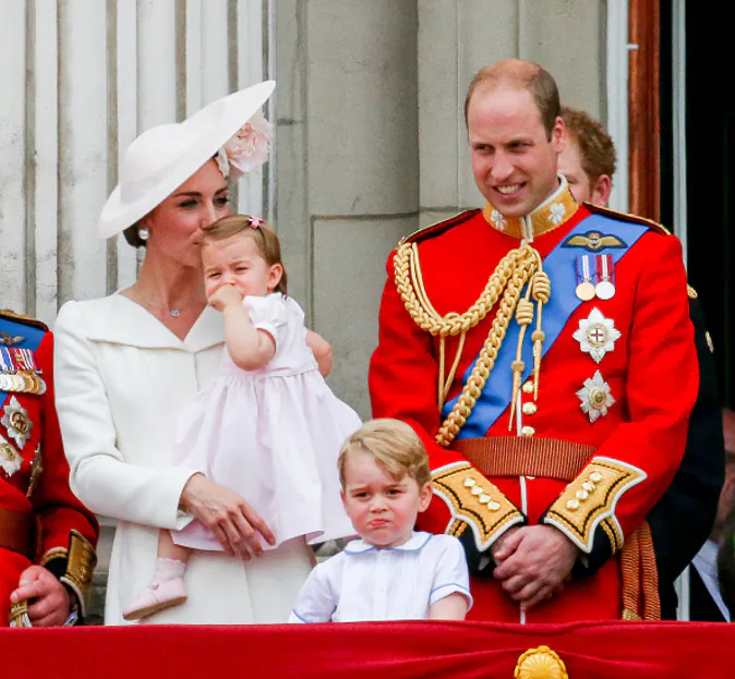 LONDON, ENGLAND - JUNE 11: Catherine, Duchess of Cambridge, Princess Charlotte, Prince George and Prince William, Duke of Cambridge stand on the balcony during the Trooping the Colour. (Luca Teuchmann/WireImage)