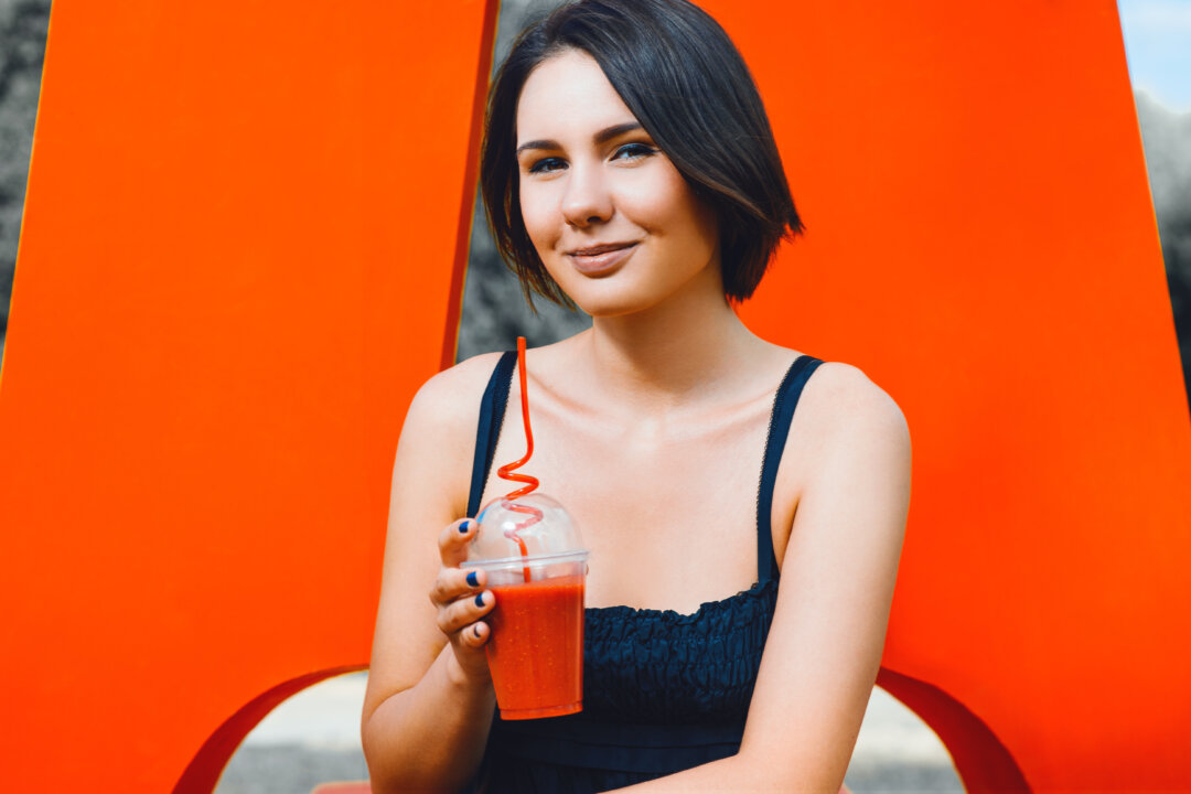 Enjoying red juice on a hot summer day. (Cressida studio/Shutterstock)