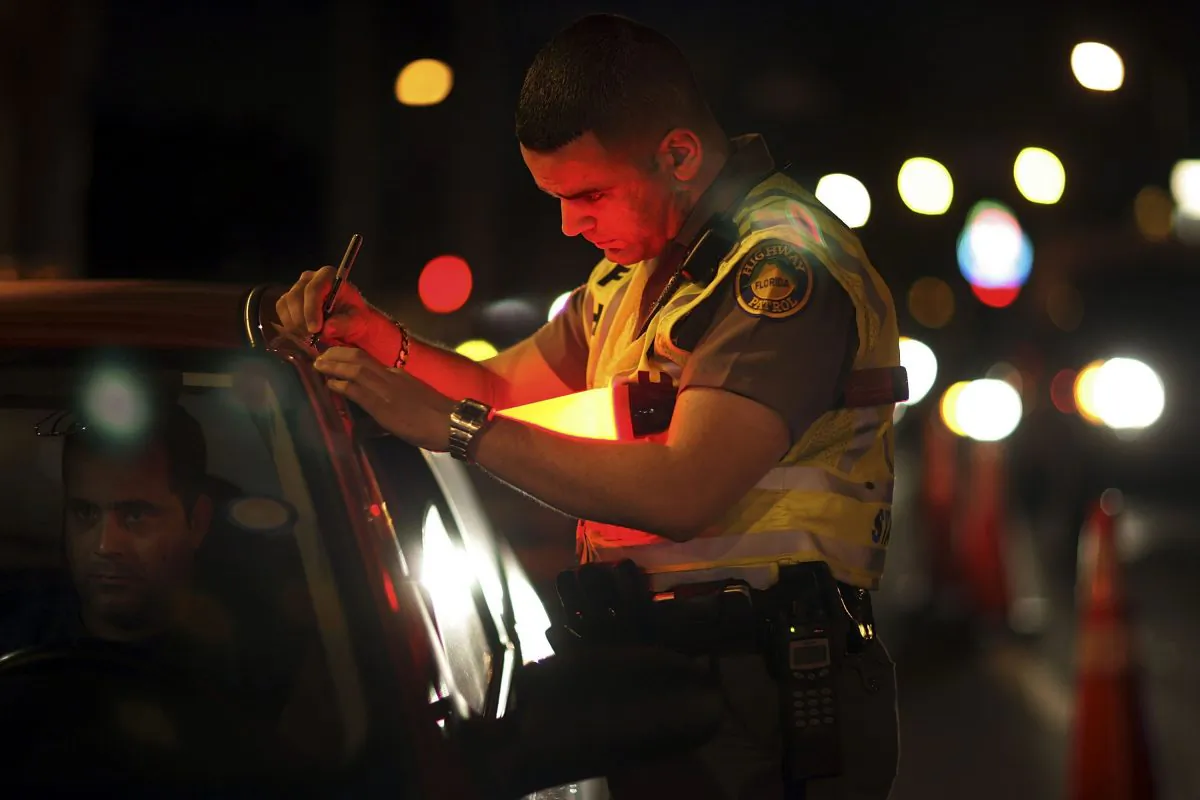A Florida Highway Patrol trooper talks to a driver at a DUI checkpoint in Miami, Fla., on Dec. 15, 2006. (Joe Raedle/Getty Images)