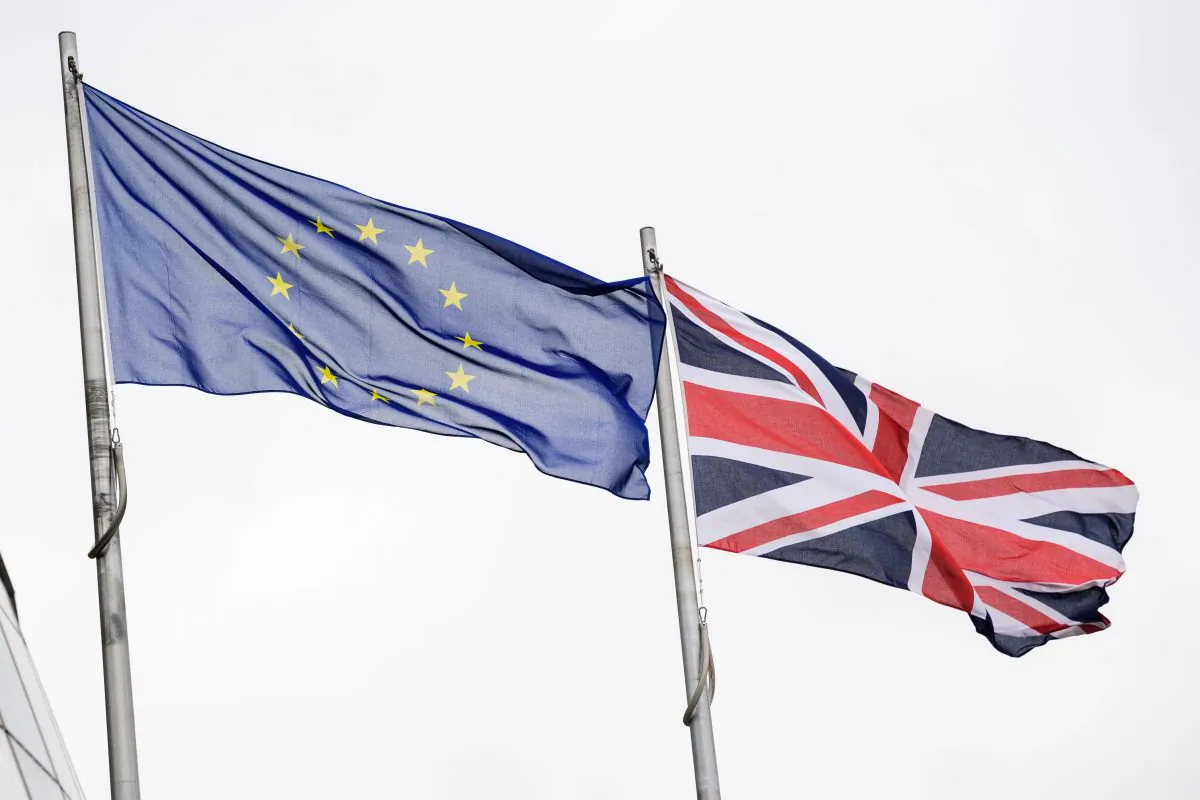 The European Union and the United Kingdom flags fly outside City Hall in central London on the eve of the EU referendum on June 22, 2016. (Leon Neal/AFP/Getty Images)