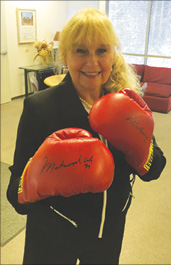  Lina wearing boxing gloves autographed by Ali. (Courtesy of Donna Katto)