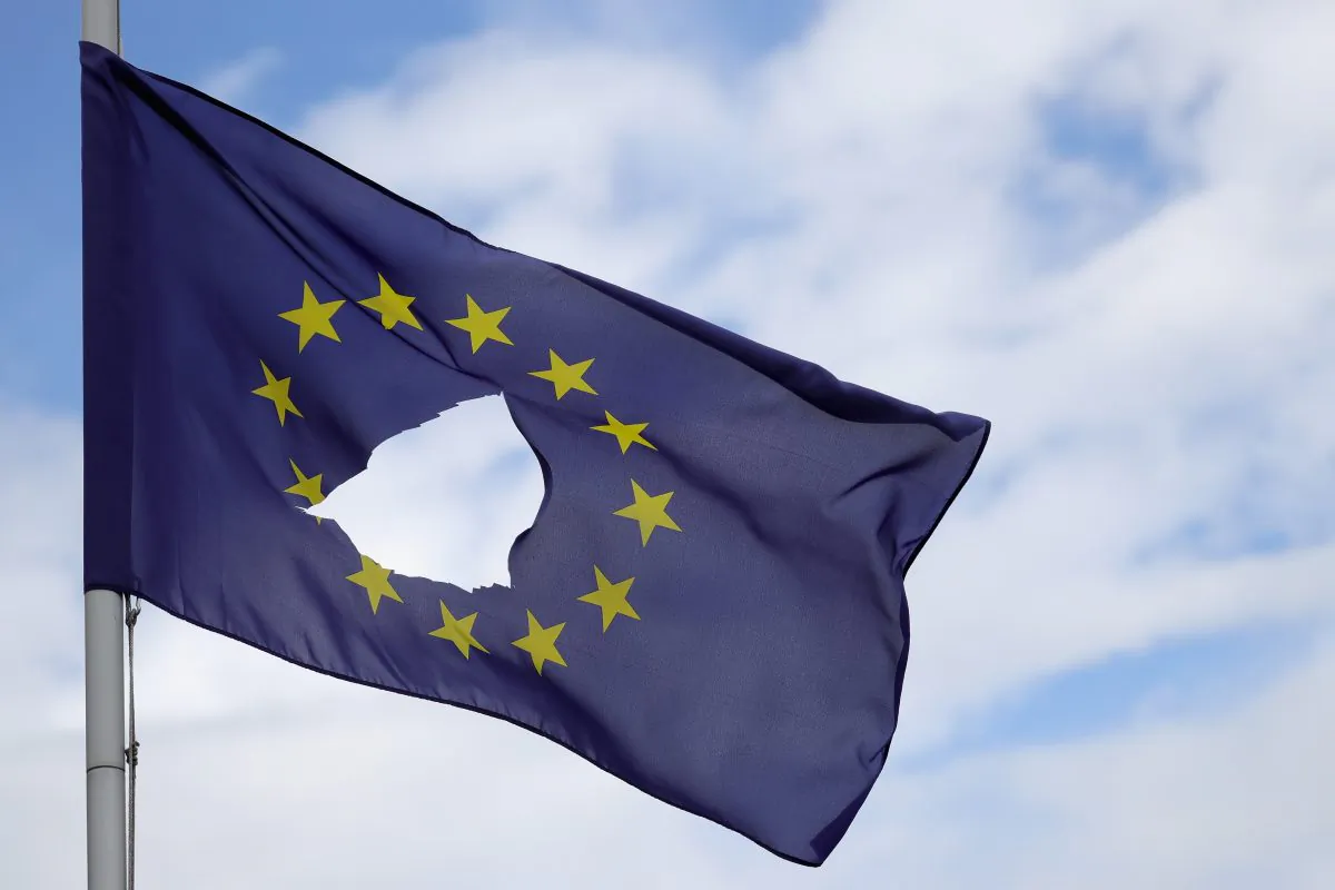 A European Union flag, with a hole cut in the middle, flies at half-mast outside a home in Knutsford Cheshire after the historic June 23 EU referendum, in Knutsford, U.K., on June 24, 2016. (Christopher Furlong/Getty Images)