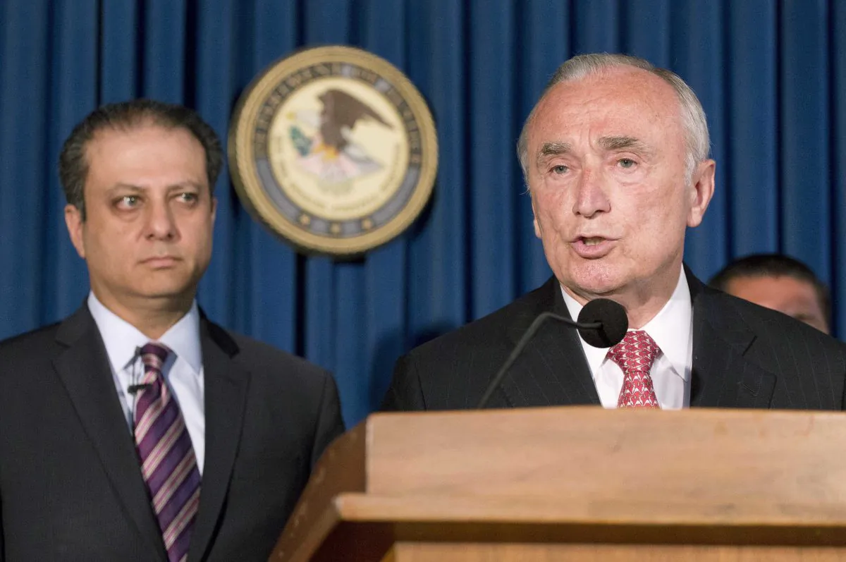 U.S. Attorney Preet Bharara (L) listens as NYPD Commissioner William Bratton discusses the arrest of four people in connection with New York City's ongoing corruption probe during a news conference in New York on June 20, 2016. Two high-ranking NYPD officials and a police sergeant who oversaw gun license applications were among the latest arrests in a case that has cast a cloud over the nation's largest municipal police force. (AP Photo/Mark Lennihan)