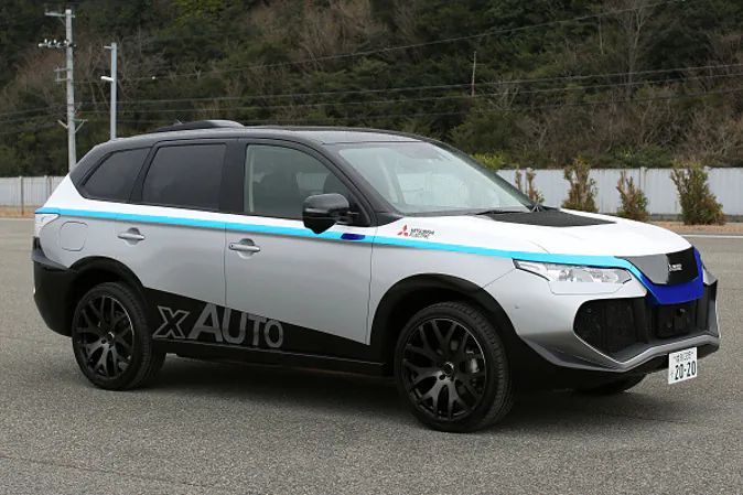 A Mitsubishi Electric Corp. self-driving vehicle stands in a test course during a demonstration in Ako, Hyogo Prefecture, Japan, on Friday, March 18, 2016. Mitsubishi Electric Corp., a supplier of air-to-air missiles to Japan's armed forces, is looking to adapt the technologies it originally developed for military use to help autonomous driving cars detect obstacles and avoid collisions. Photographer: Buddhika Weerasinghe/Bloomberg