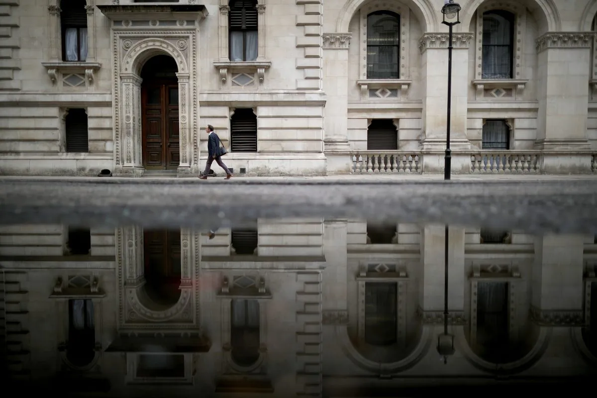A man walks past government buildings in Whitehall as David Cameron holds his first cabinet meeting since Brexit in London, England, on June 27, 2016. (Christopher Furlong/Getty Images)