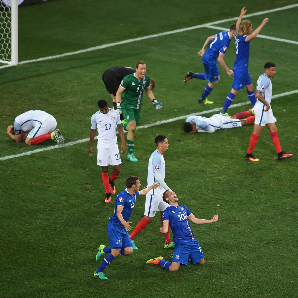 Gylfi Sigurdsson (No. 10) of Iceland falls to his knees in celebration as his team knocked out England at Euro 2016 on June 27, 2016 in Nice, France. (Laurence Griffiths/Getty Images)