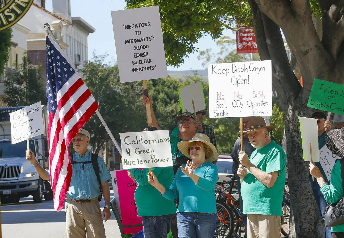 FILE - In this file photo taken, people rally in front of the San Luis Obispo County government building in support of Diablo Canyon nuclear power plant in San Luis Obispo, Calif., on March 17, 2016. (David Middlecamp/The Tribune (of San Luis Obispo) via AP, File)