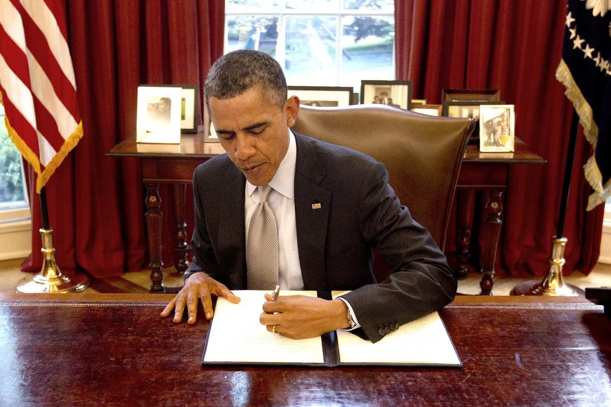 President Barack Obama signs a proclamation in the Oval Office of the White House on April 20, 2012, to designate federal lands within Fort Ord, a former military base located on California's Central Coast, as a National Monument under the Antiquities Act. (AP Photo/Pablo Martinez Monsivais)