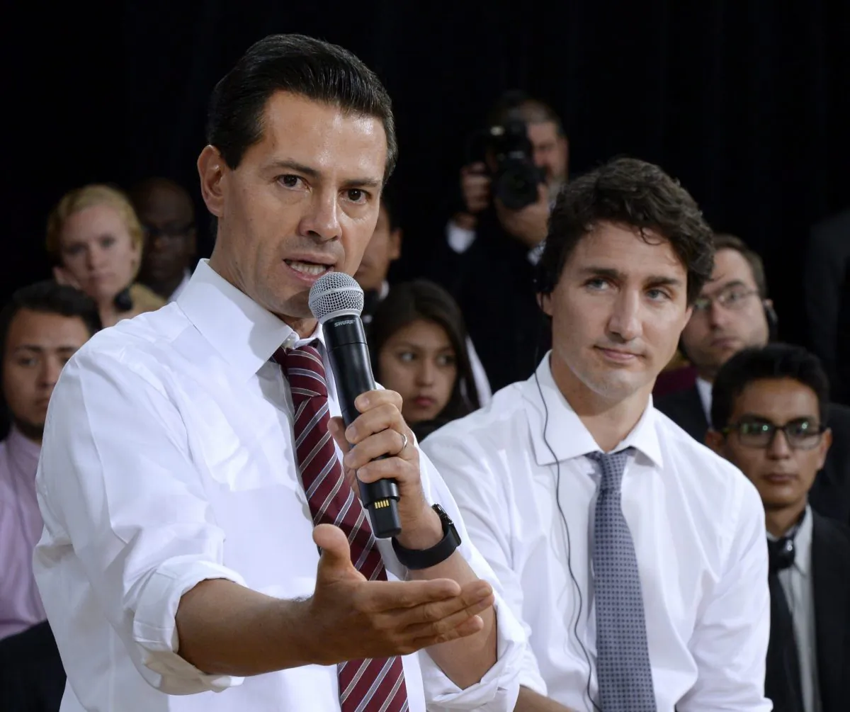 Canada's Prime Minister Justin Trudeau, right, listens as Mexico's President Enrique Pena Nieto answers a question during a Q&A with youth at the Museum of Nature, on Tuesday, June 28, 2016 in Ottawa. (Justin Tang/The Canadian Press via AP) MANDATORY CREDIT