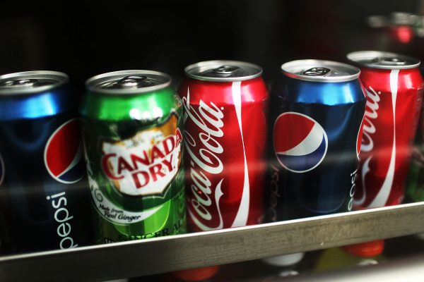 Cans of soda are displayed on a shelf in New York City on Jan. 23, 2013. (Spencer Platt/Getty Images)