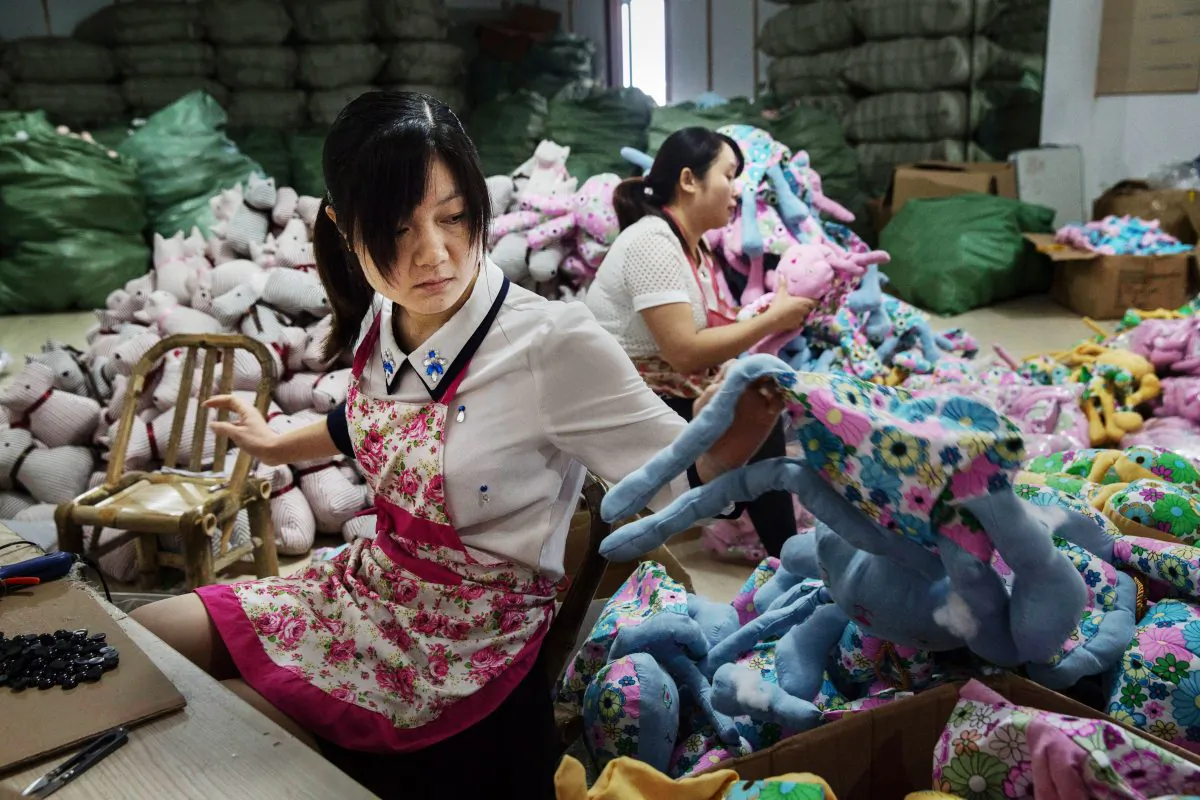 Chinese workers prepare stuffed toys at a factory in  Zhejiang, China, September 17, 2015  (Kevin Frayer/Getty Images)