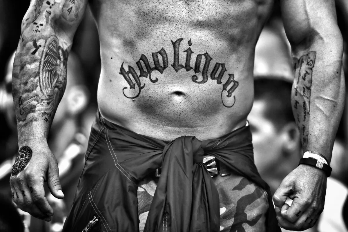 A Hungary supporter shows off a tattoo on his torso reading "Hooligan" during the UEFA EURO 2016 Group F match between Iceland and Hungary at Stade Velodrome in Marseille, France, on June 18, 2016. (Lars Baron/Getty Images)