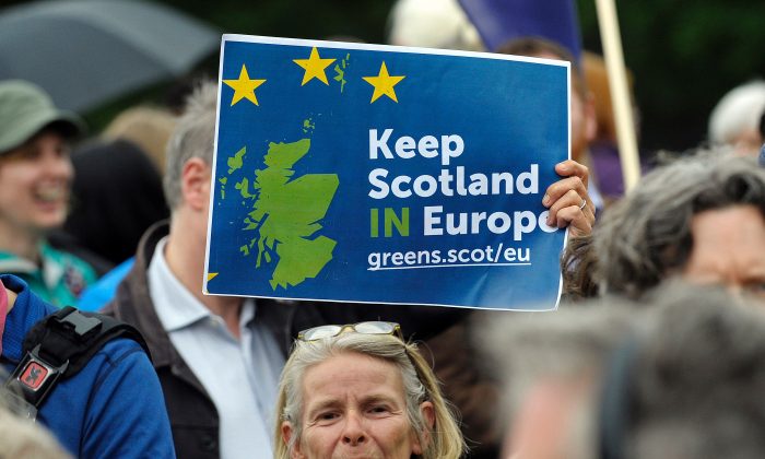 A woman holds up a placard at a demonstration by Pro EU campaigners outside the Scottish Parliament ahead of a debate on the EU Referendum result and the implications for Scotland, in Edinburgh, Scotland on June 28, 2016.
The Scottish National Party is weighing another referendum on Scotland separating from the U.K. after the “leave” side won last week’s Brexit referendum. (ANDY BUCHANAN/AFP/Getty)
