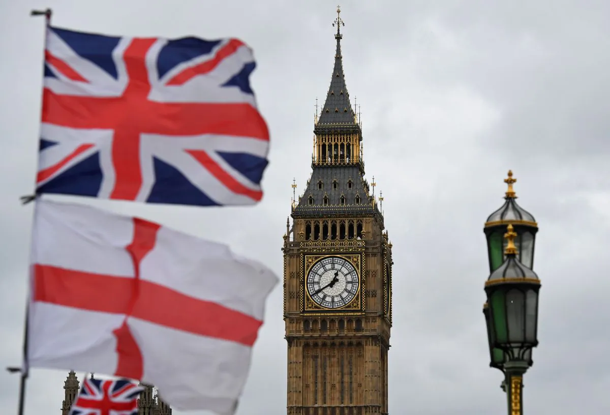 A Union flag flies above an English St. Georges Cross flag near the Big Ben clock face and the Elizabeth Tower at Houses of Parliament in central London on June 29, 2016.
(BEN STANSALL/AFP/Getty Images)
