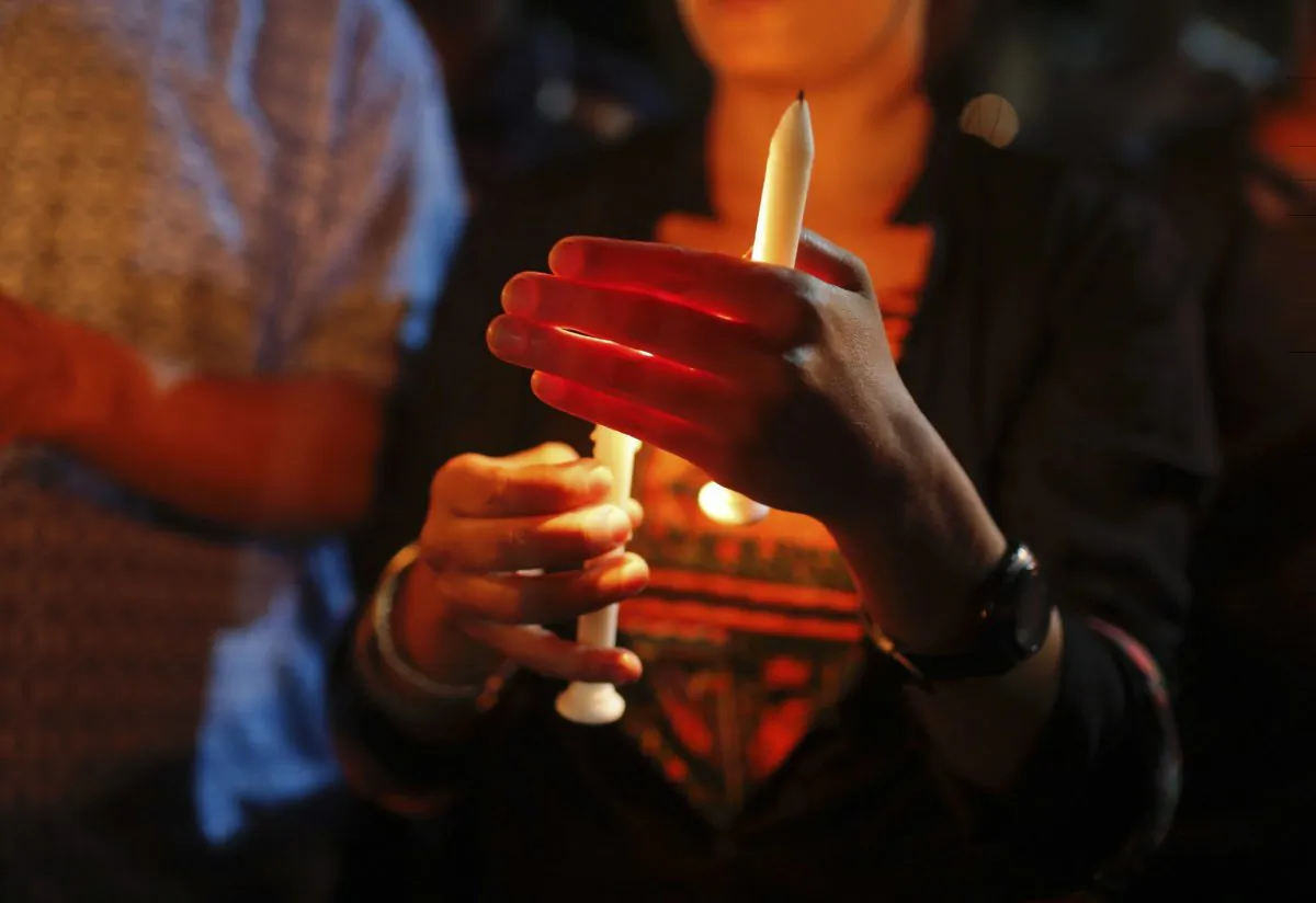 Bangladeshis light candles as they pay tribute to those killed in the attack at the Holey Artisan Bakery in Dhaka, Bangladesh, Sunday, July 3, 2016. The assault on the restaurant in Dhaka's diplomatic zone by militants who took dozens of people hostage marks an escalation in militant violence in the Muslim-majority nation. (AP Photo)