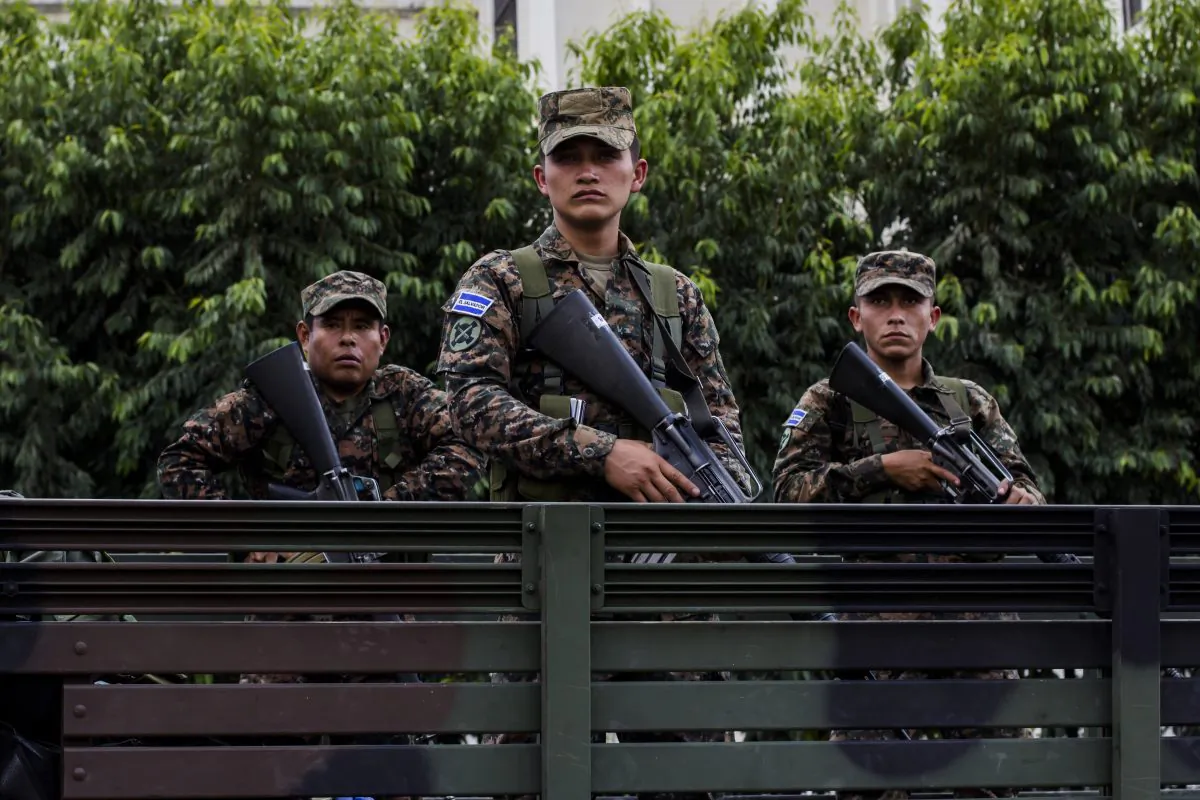 Reserve soldiers stand on a truck during a presentation to the press at the Central Square in San Salvador, El Salvador, June 14, 2016, as part of extraordinary security measures to dismantle gangs. (AP Photo/Salvador Melendez)