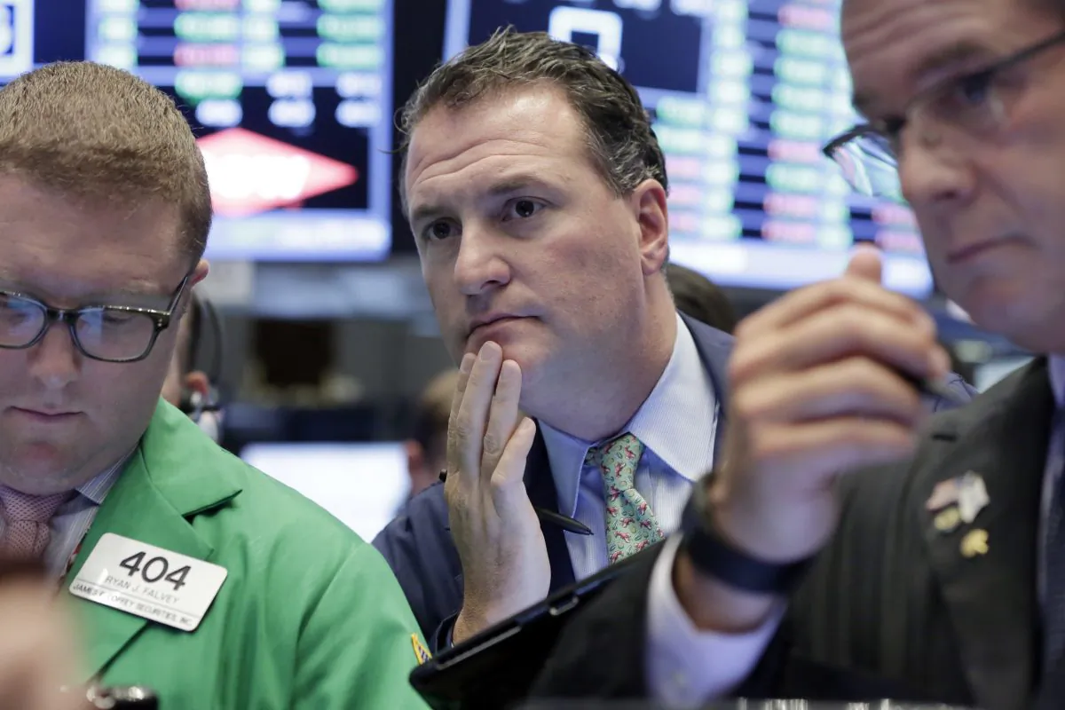 Trader Jonathan Corpina (C) works on the floor of the New York Stock Exchange on June 29, 2016. (AP Photo/Richard Drew)