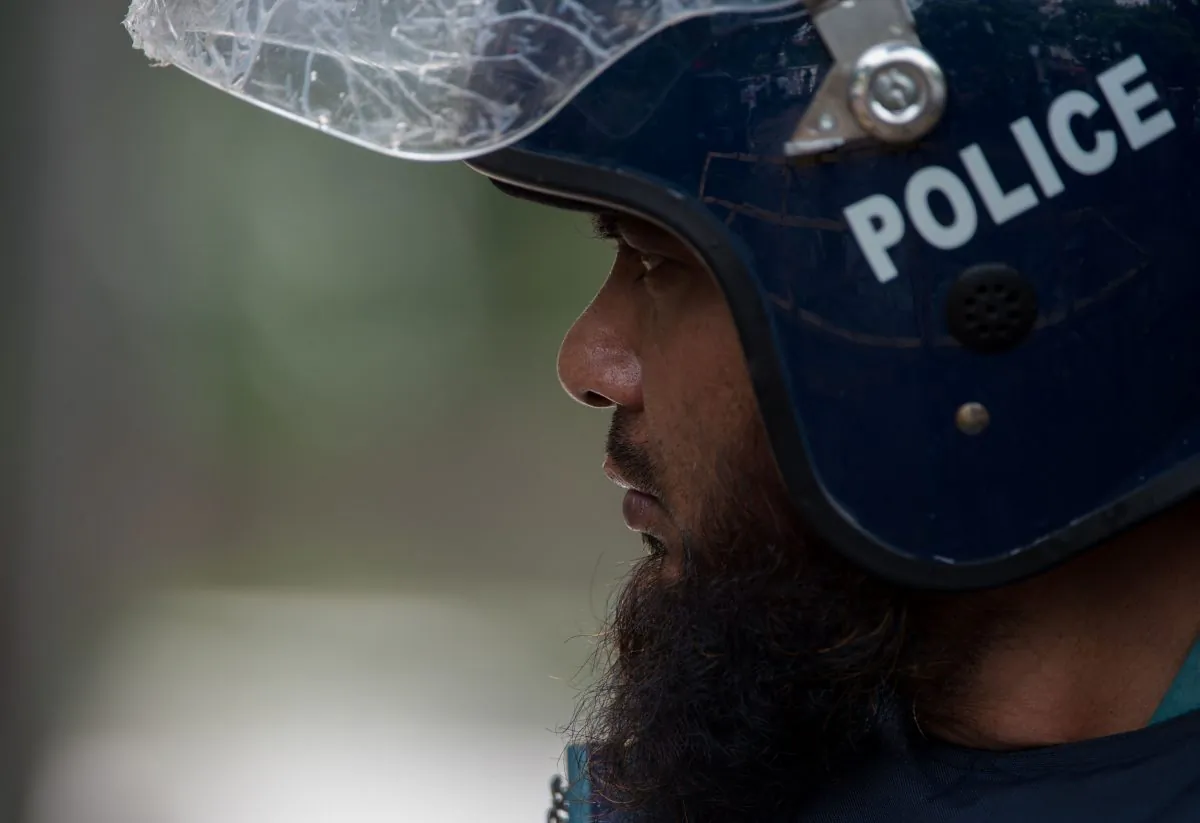 A Bangladeshi policeman mans a road block near a cafe on July 3, 2016, a day after a bloody siege at the restaurant came to an end. (Roberto Schmidt/AFP/Getty Images)