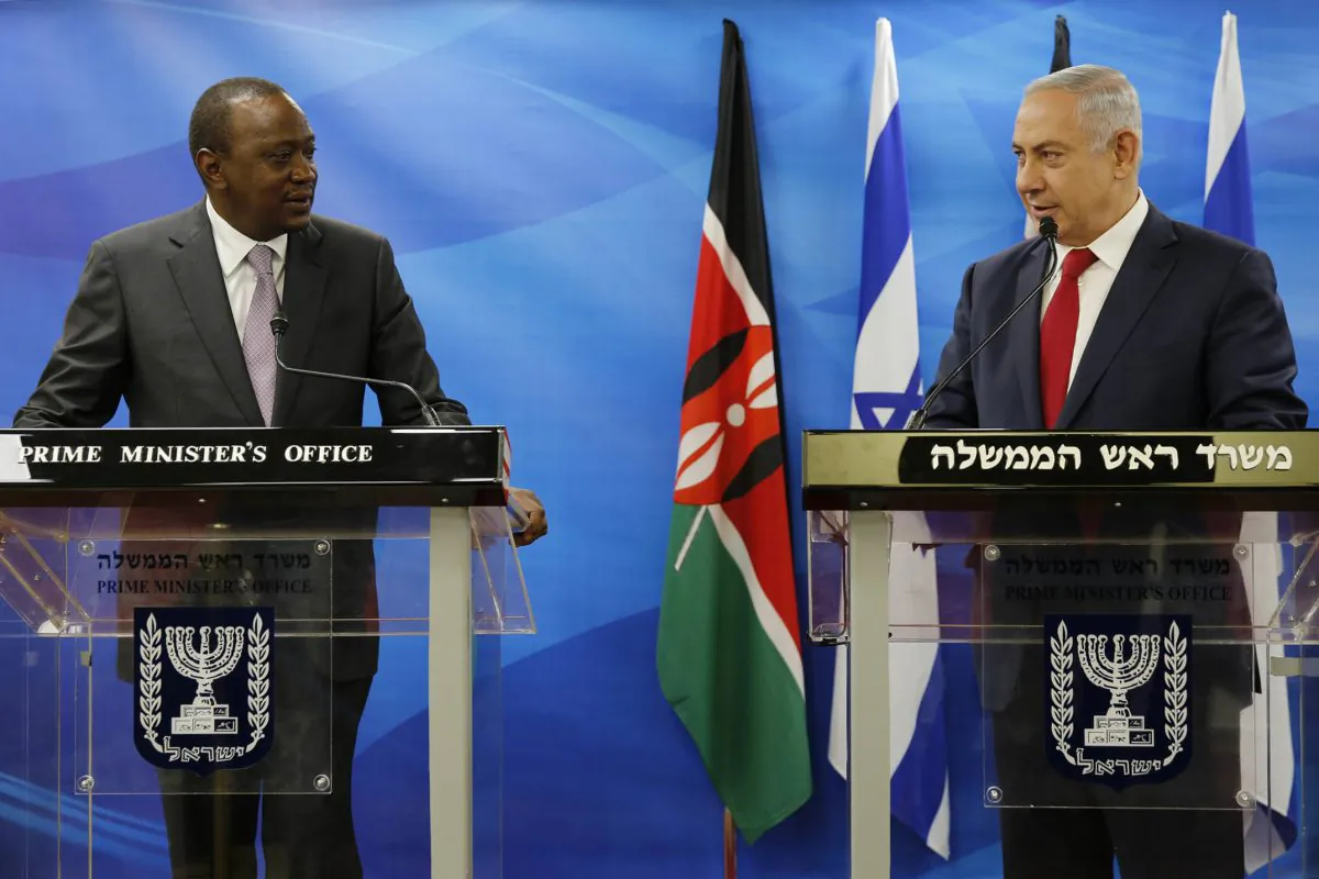Kenya's President Uhuru Kenyatta (L) stands next to Israeli Prime Minister Benjamin Netanyahu as they deliver joint statements in Jerusalem on Feb. 23, 2016. (Amir Cohen, Pool via AP)
