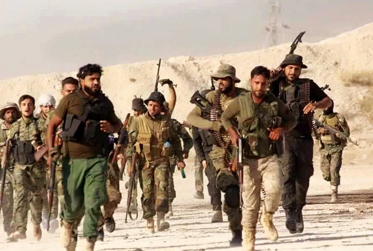 A file photo released June 28, 2016 by the New Syrian Army, an anti-government rebel group, which has been authenticated based on its contents and other AP reporting, shows U.S.-backed Syrian rebels of the New Syrian Army running in an unknown place in Syria. A humiliating defeat came June 29, 2016 for the New Syrian Army's offensive to capture Boukamal, a prize possession of the Islamic State and their last border crossing between Iraq and Syria. The quick unraveling of the budding offensive reflects the difficulties in U.S. efforts to create an effective Syrian force against ISIS. (New Syrian Army via AP)