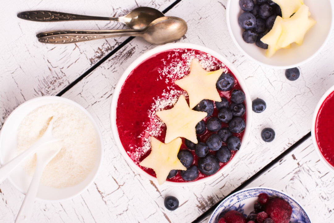 Red berry smoothie with apple stars, blueberry and coconut chips. (Ekaterina Markelova/Shutterstock)