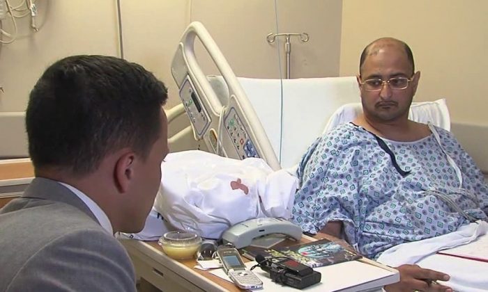 In this June 29, 2016 frame from video, Ahmed al-Menhali, right, is interviewed by WEWS at St. John Medical Center after he collapsed following an encounter with police in Avon, Ohio. Al-Menhali's treatment outside a hotel in Avon, Ohio, became front-page news in the Emirates, a key U.S. ally that is home to the commercial hub of Dubai, and prompted the federation's government to formally summon a U.S. diplomat for an explanation. (WEWS via AP)