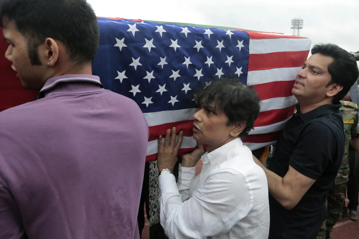 Relatives of Abinta Kabir, student of Emory University of U.S., carry her coffin draped with the Bangladesh and U.S. flags after a ceremony for victims of the attack on the Holey Artisan Bakery, in Dhaka, Bangladesh, Monday, July 4, 2016. The brutality of the attack, the worst convulsion of violence yet in the recent series of deadly attacks to hit Bangladesh, has stunned the traditionally moderate Muslim nation and raised global concerns about whether it can cope with the increasingly strident Islamist militants. (AP Photo)