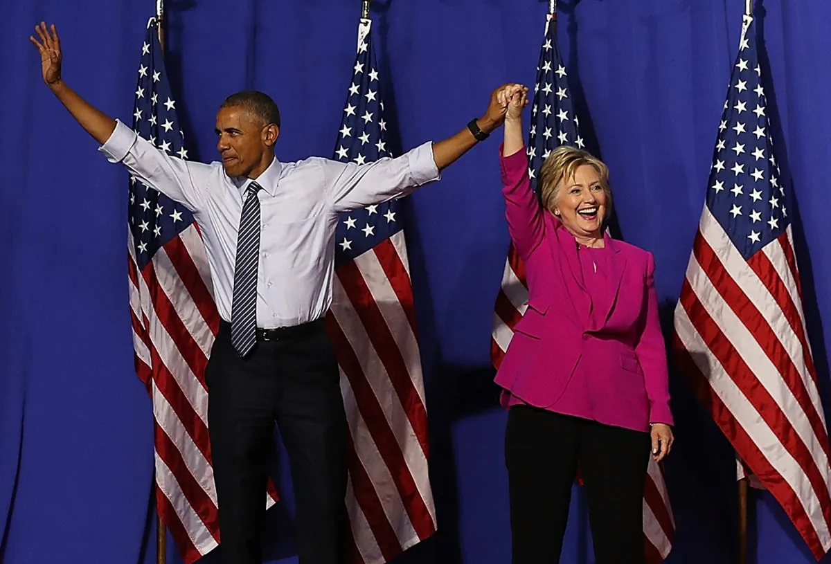 Democratic presidential candidate Hillary Clinton and President Barack Obama greet supporters during a campaign rally in Charlotte, North Carolina, on July 5, 2016. (Justin Sullivan/Getty Images)