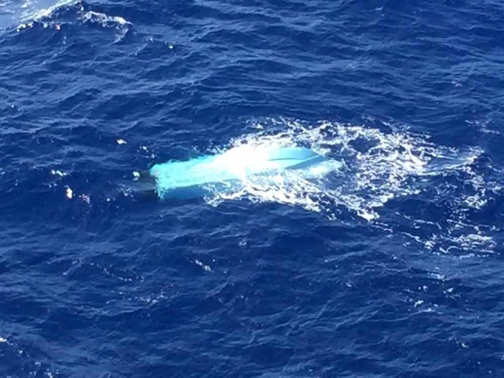 The Coast Guard and the Navy are searching for three missing fishermen reported overdue north northwest of Oahu, July 4, 2016. Their 20-foot fishing vessel Iwa, was spotted overturned by the Coast Guard approximately 25 miles off of Haleiwa Boat Harbor. (U.S. Coast Guard photo/Released)