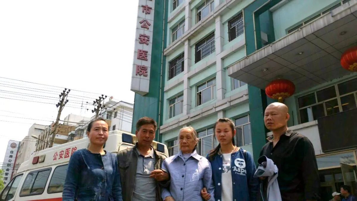 Gao Yixi's family stands outside the Mudanjiang Public Security Hospital on June 9, 2016. (Courtesy of family)